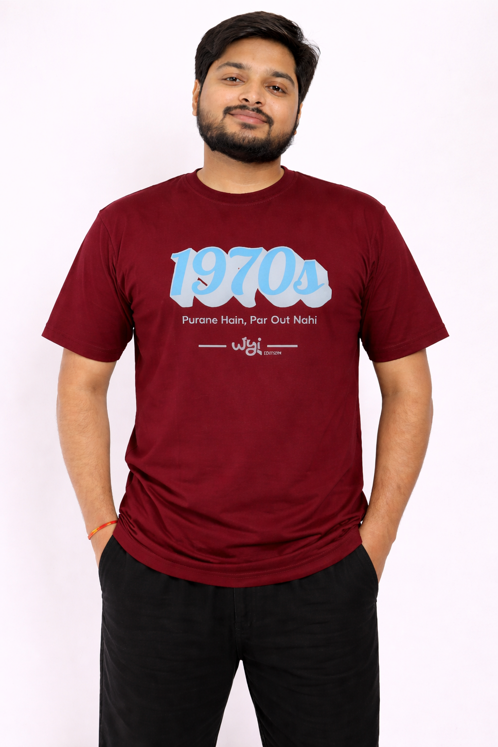 Man wearing a maroon t-shirt with '1970s' text design on a white background.