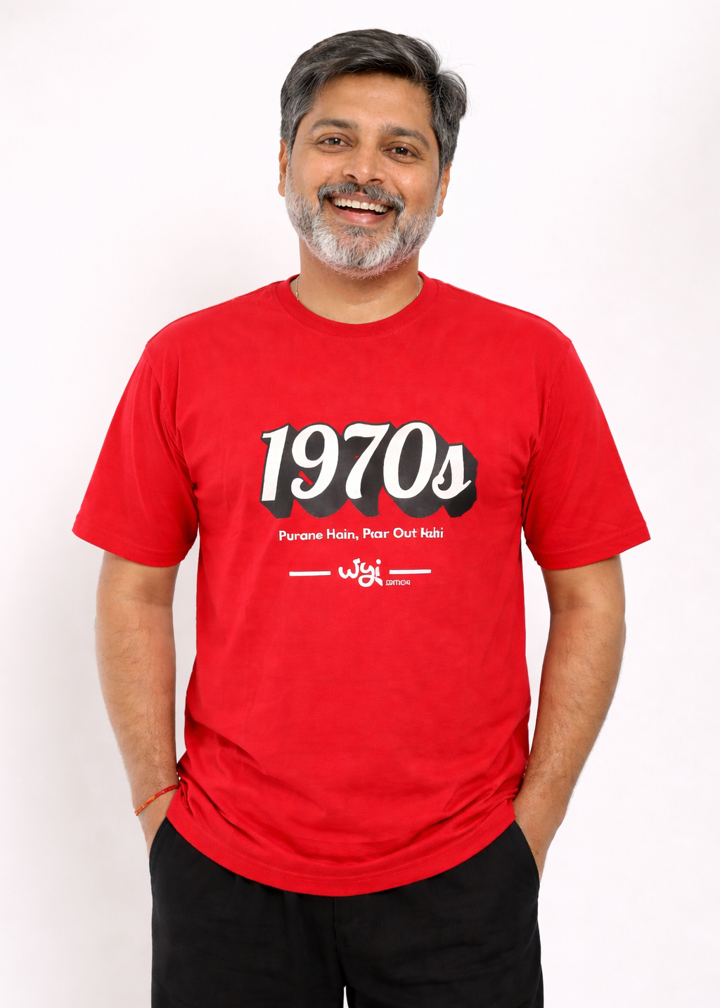 Man wearing a wyi red t-shirt with '1970s' design on a white background
