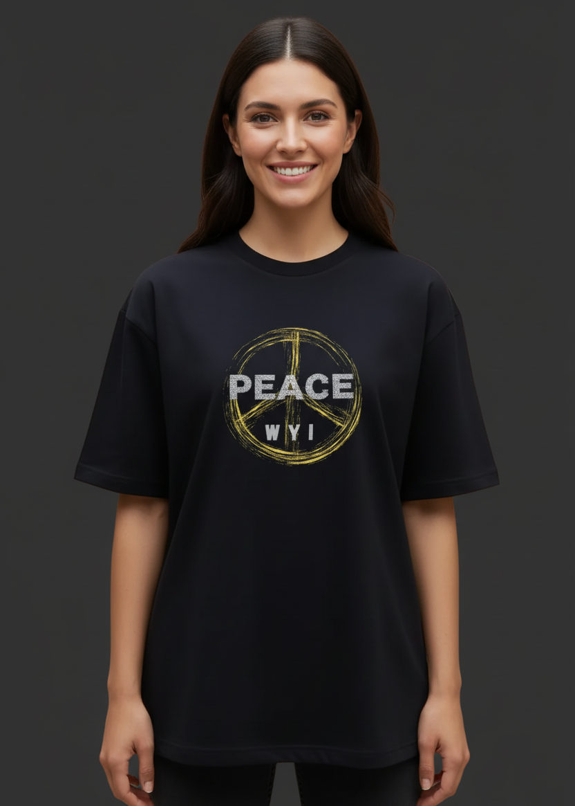 Woman wearing a black t-shirt with 'PEACE WYI' design on a dark background