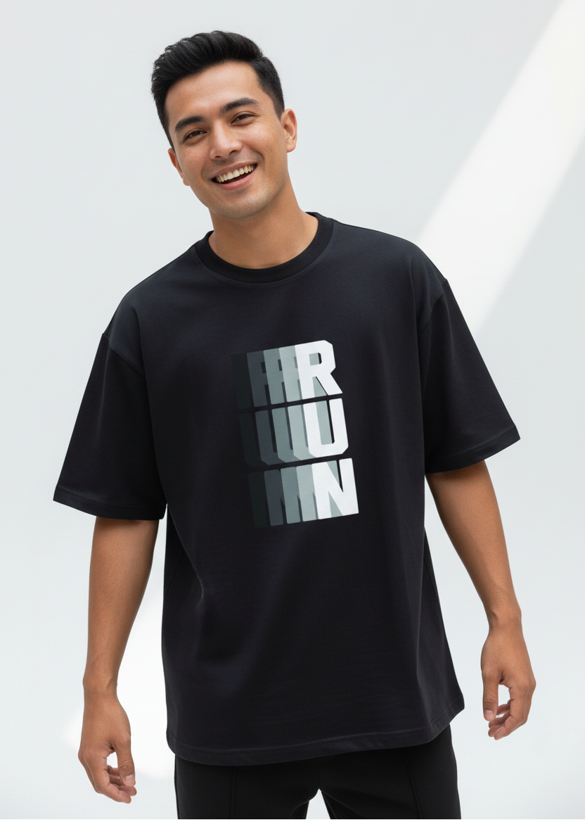 WYI Black t-shirt with white and gray text on a brown background
